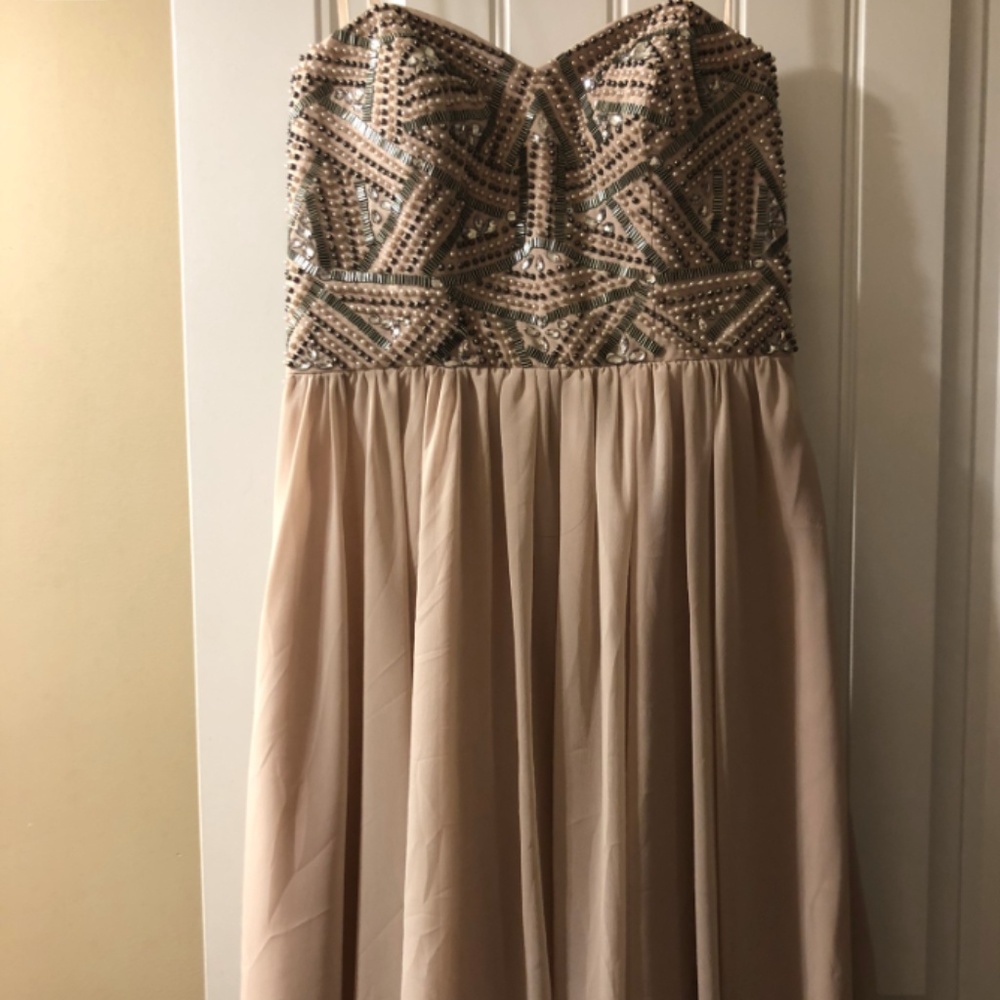 Short, light pink beaded dress